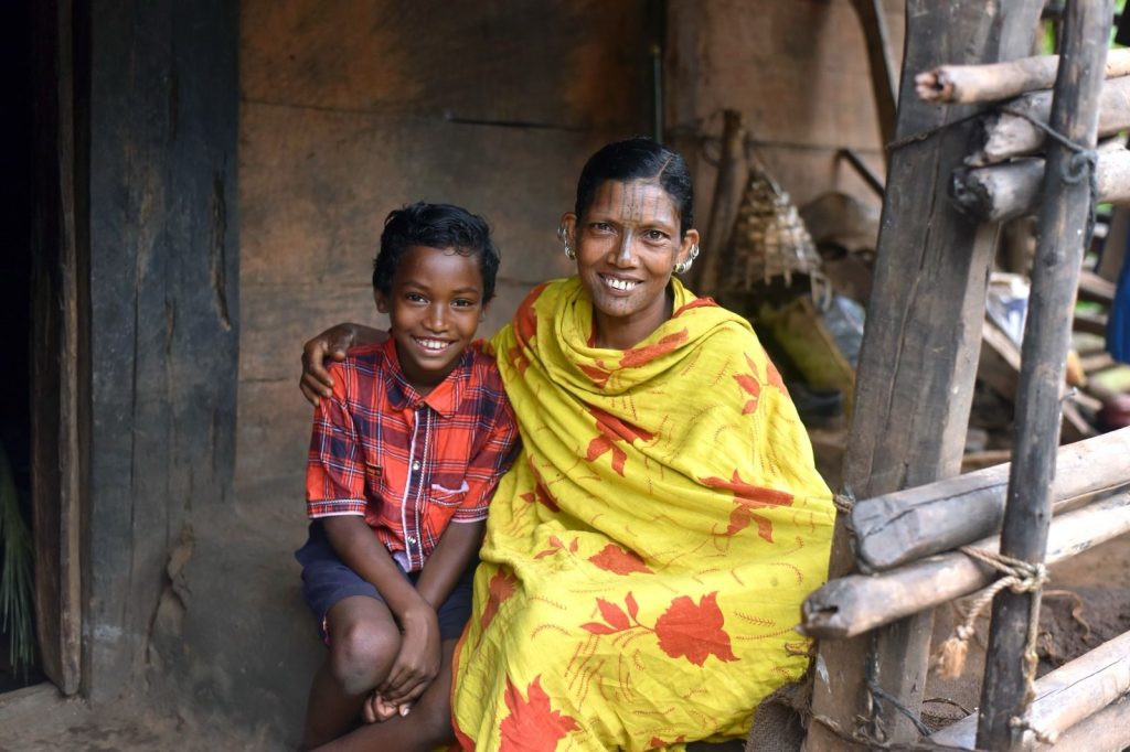 Smiling woman and boy together outdoors
