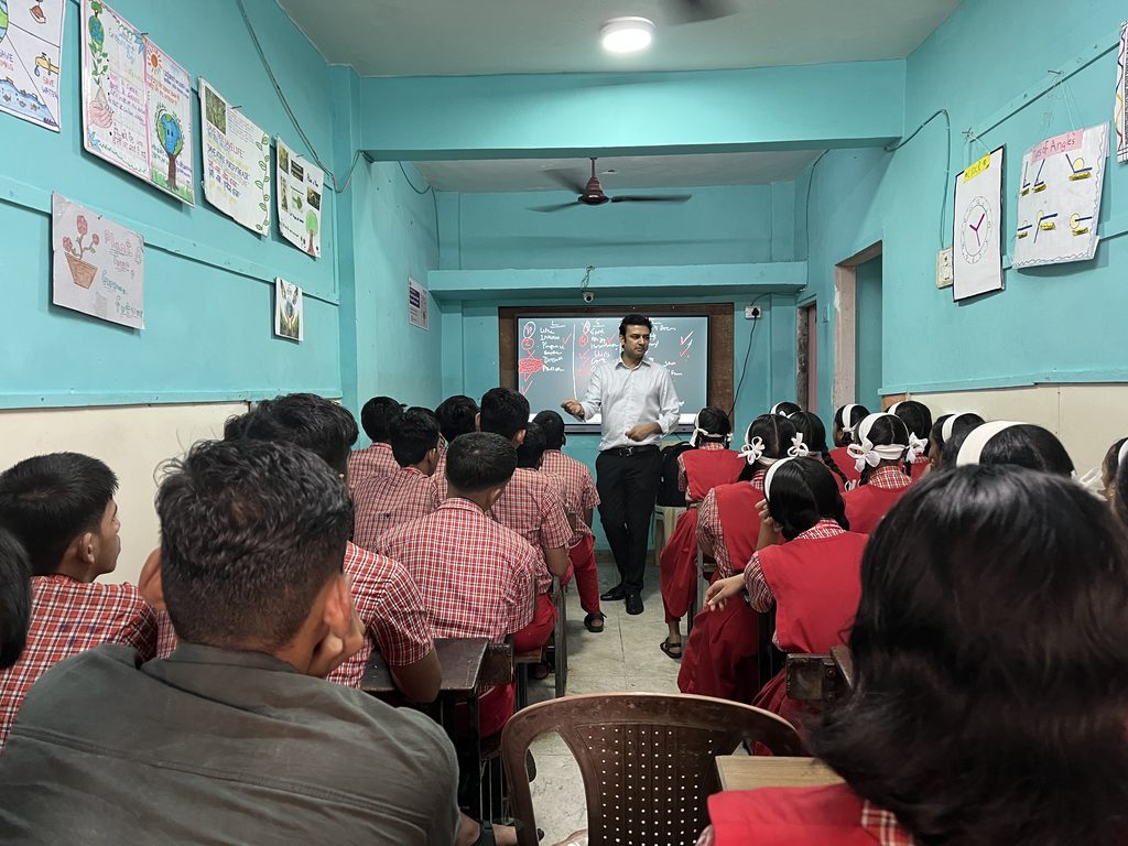 Children learning together in a Smile Foundation Mission Education classroom to narrow the AI divide in education through interactive teaching.
