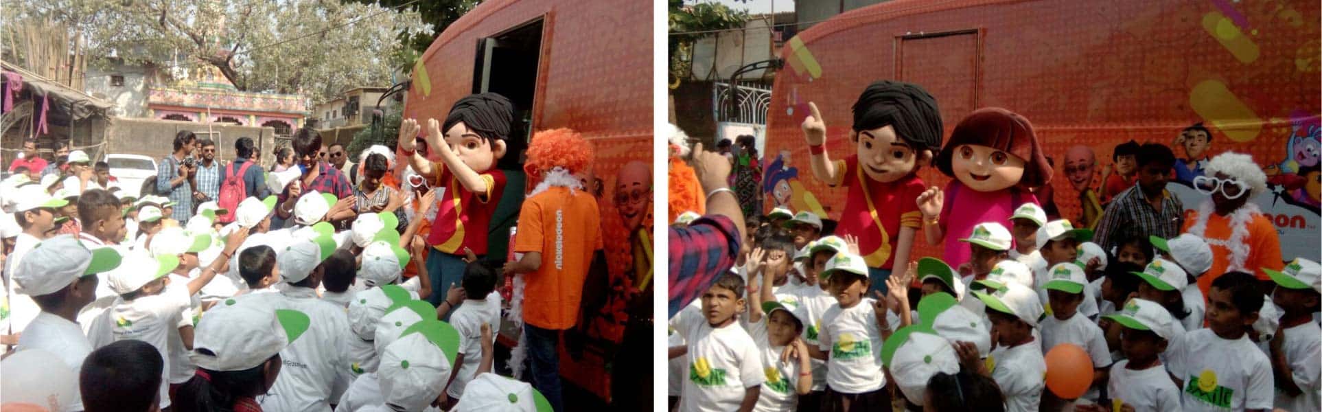 Cartoon characters Dora and Shiva have fun with Smile Foundation kids